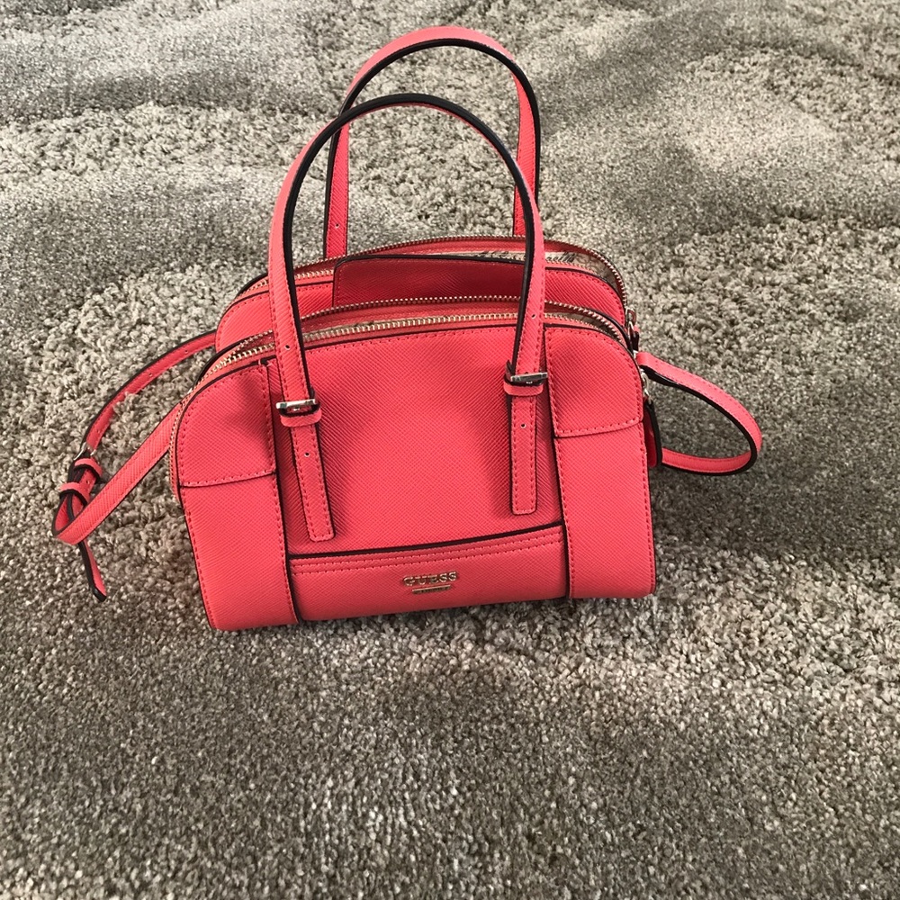 Medium pink cross body Guess purse