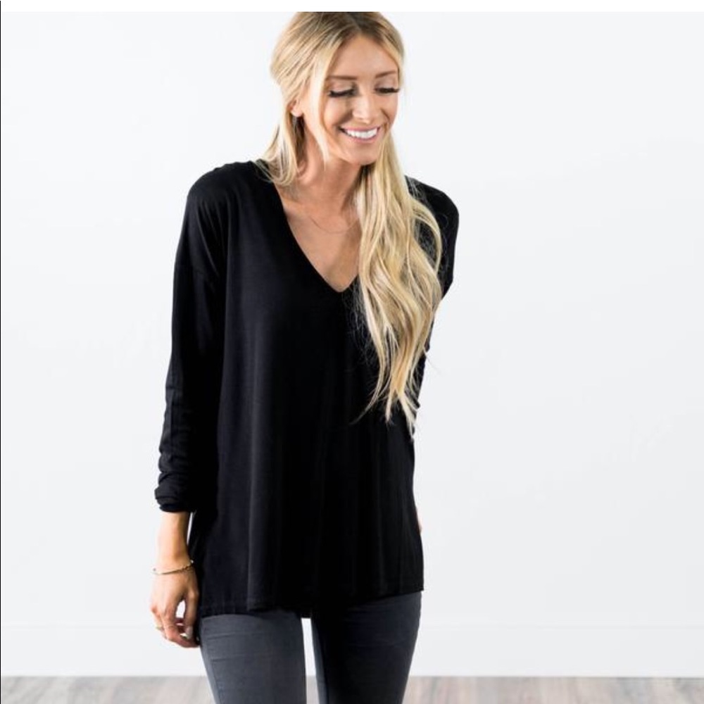 Brand new darling black shirt,longer in the back