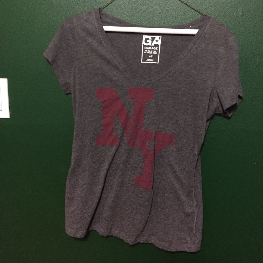Gray v-neck shirt with red lettering