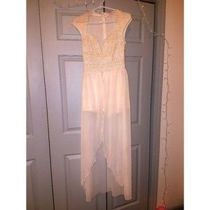 White jumpsuit with shorts and sheer overlay