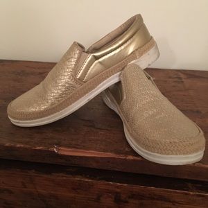 Gold slip on sneakers