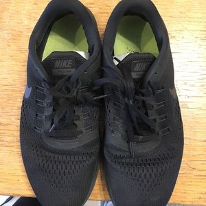 Black Nike sneakers, average condition, size 8.5.