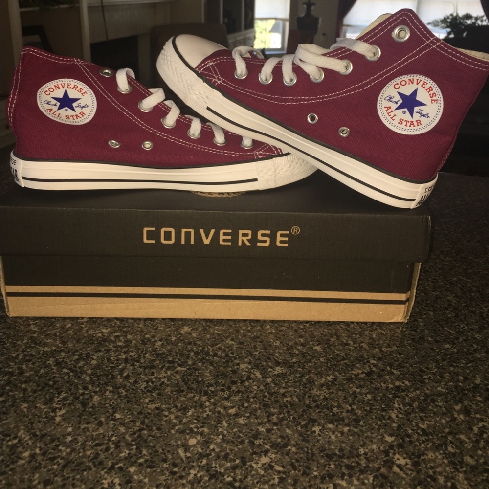 Maroon hight top Converse.