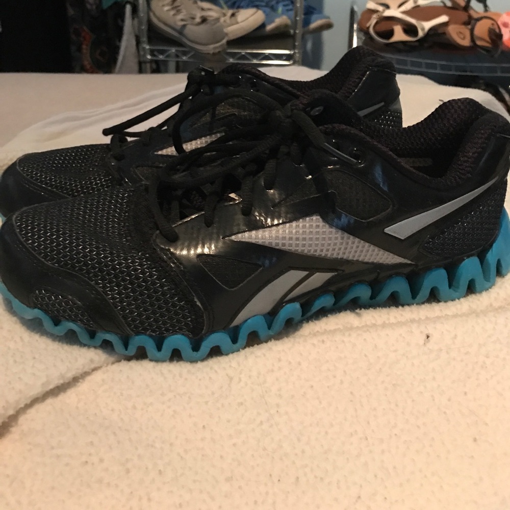 Black and blue reebok shoes
