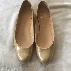 Gold Christian Louboutin flats