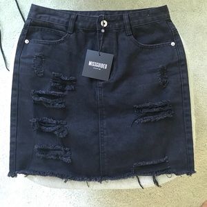 Black distressed denim skirt