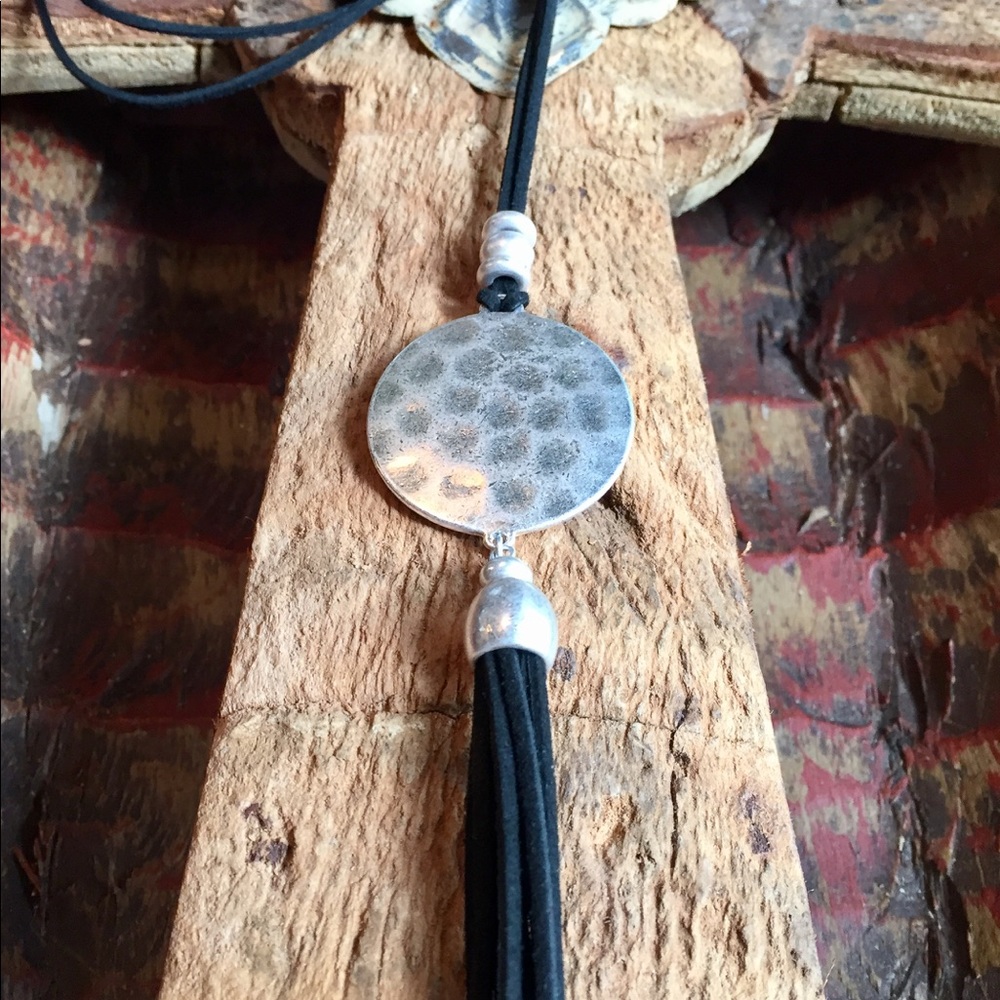 Black necklace with black tassel and silver disc