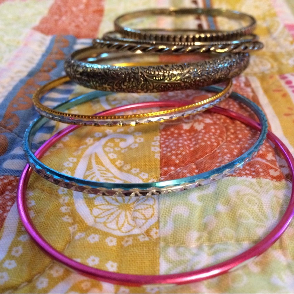 Stack of Avon bracelets