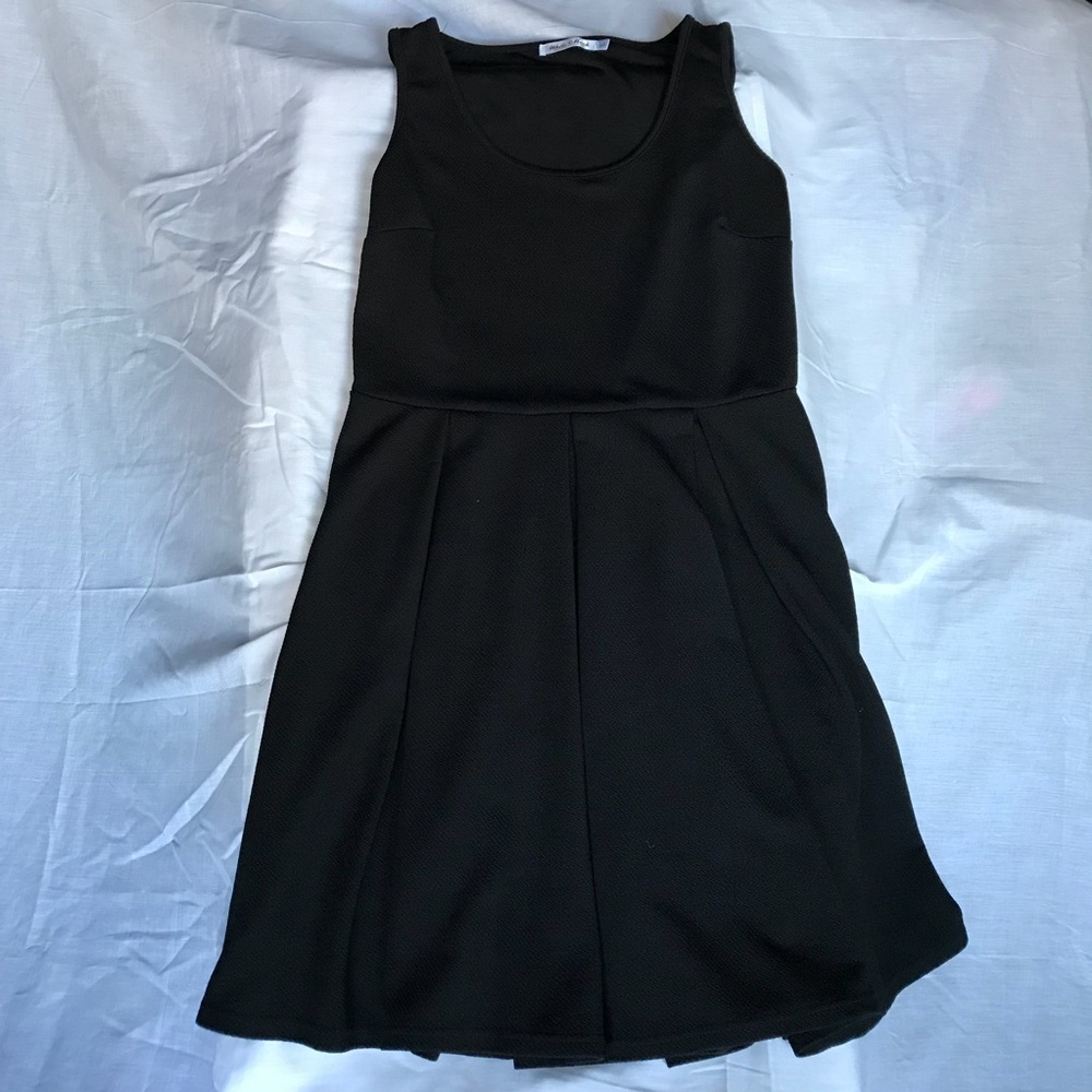 Black textured dress with pleated bottom