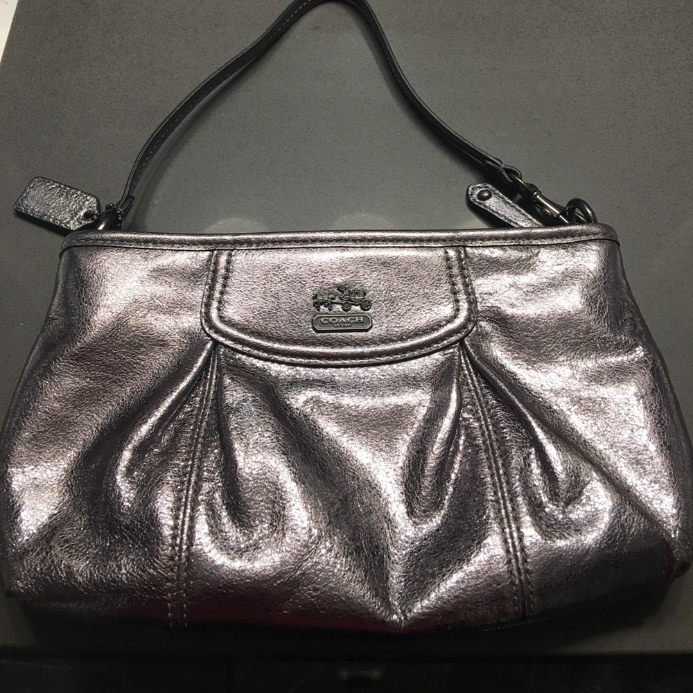 Metallic coach wristlet clutch