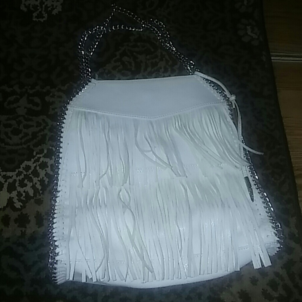 Carlos Santana white habdbag