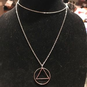 Silver colored circle w/triangle dangling w/Chain
