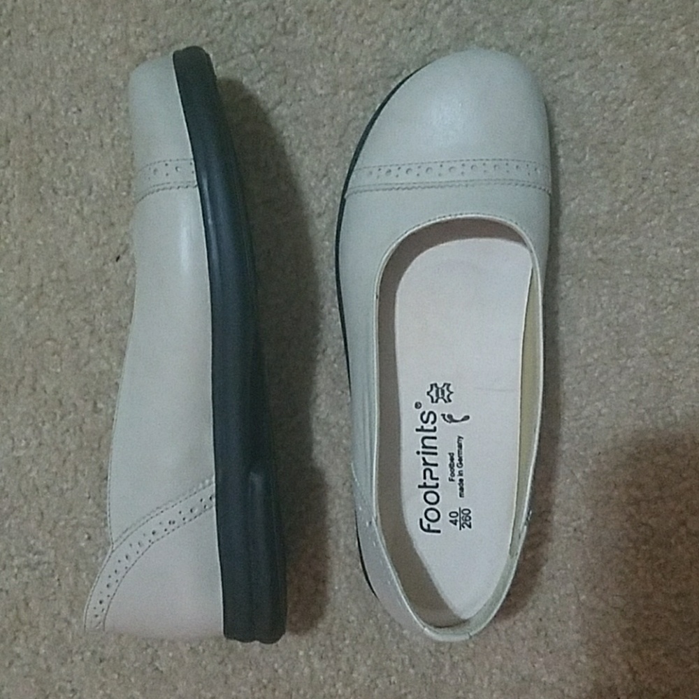 Footprints by Birkenstock shoes.