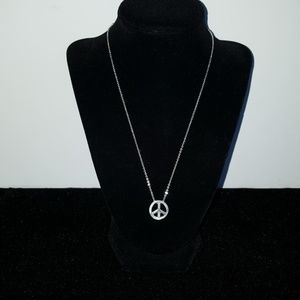 Silver tone peace sign necklace Silver tone peace sign necklace