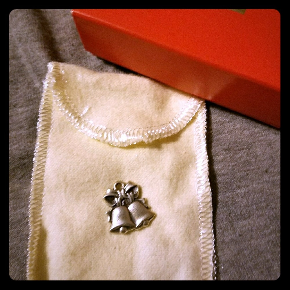 Retired James Avery wedding bell charm.