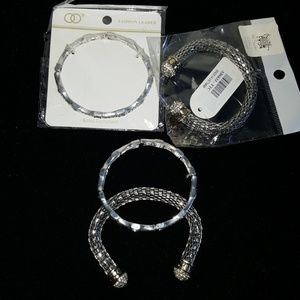 Two stackable silver tone bracelets