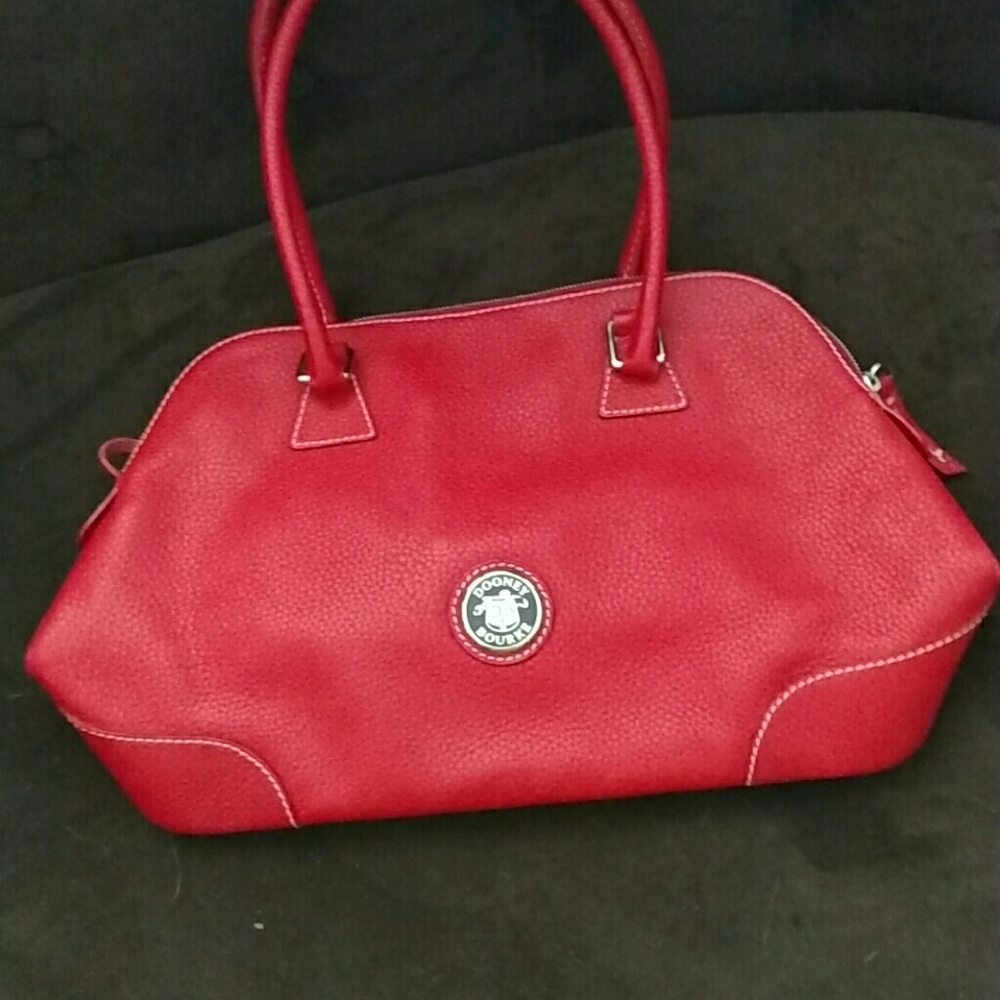 Ladies red leather Dooney and Bourke purse.