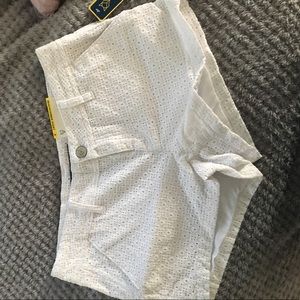 White shorts with flower like detailing