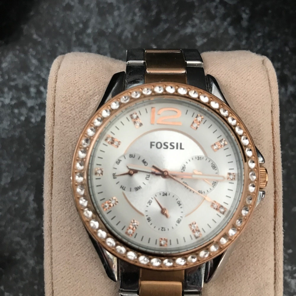 Fossil Women's silver and gold watch.