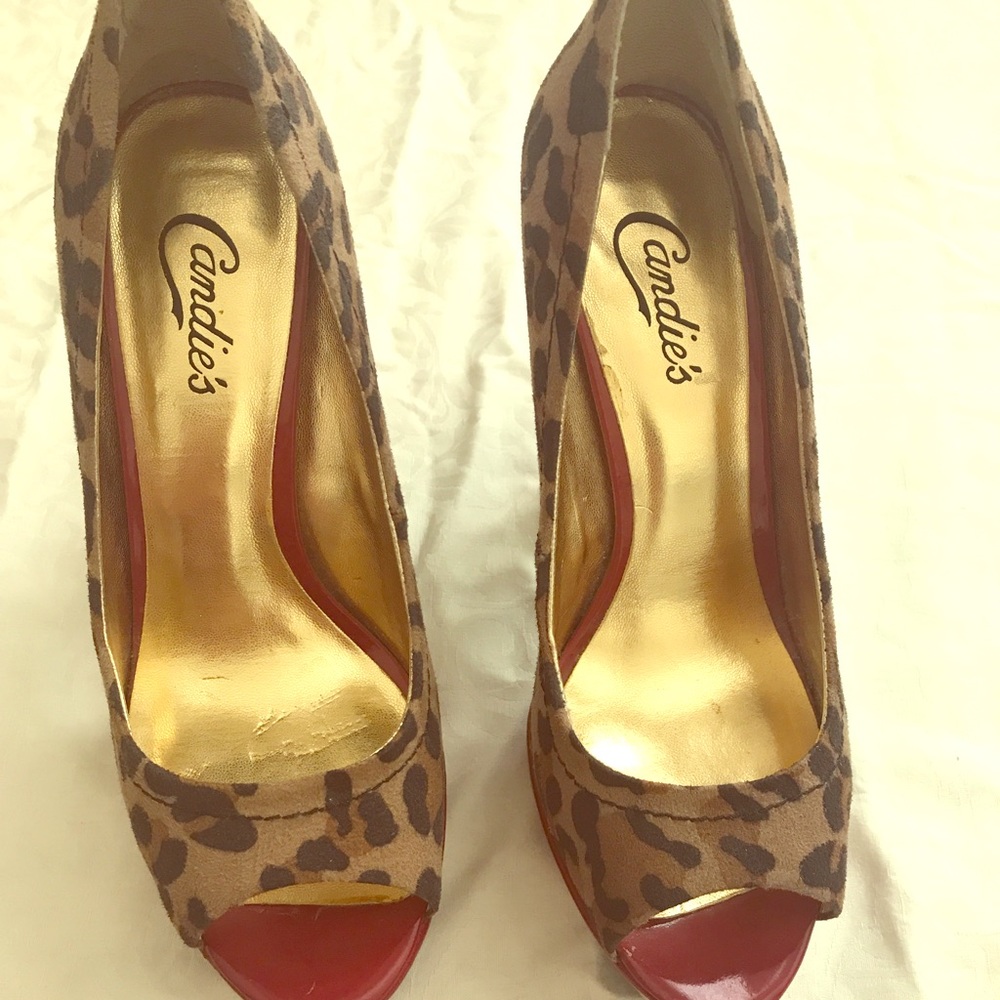 Open leopard print peep toe pumps.