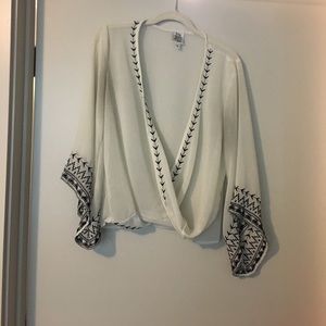 Embroidered faux wrap top