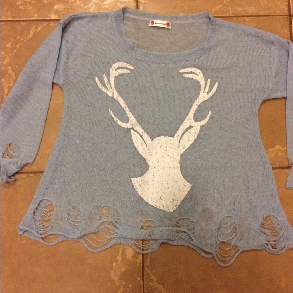 Cute distressed sweater.