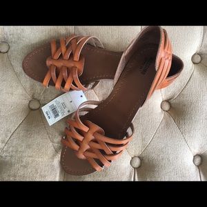 Woven faux leather slip-on loafers.