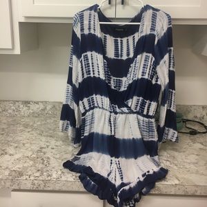 Two boutique rompers sold together
