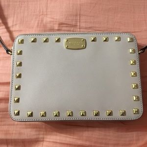 Michael Kors purse. Tan with studs. Small damage