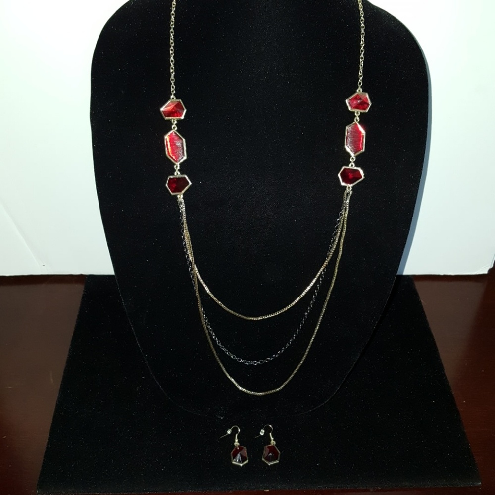 Long gold tone and red stone necklace and earring