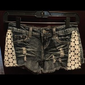 Distressed denim shorts