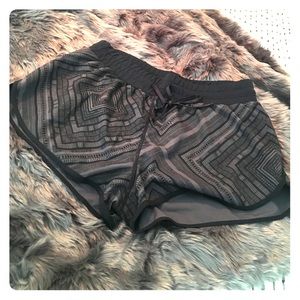 Black and gray Fabletics running shorts