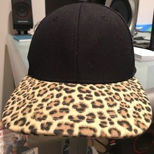 Black cap with long leopard print bill