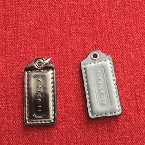 Coach two small hand tags in grey color no chain