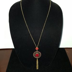 Gold tone and red stone necklace