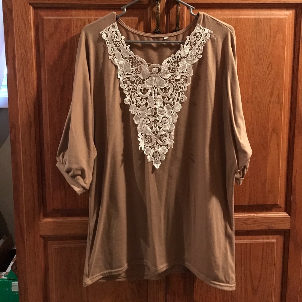 Taupe top with lace trim.