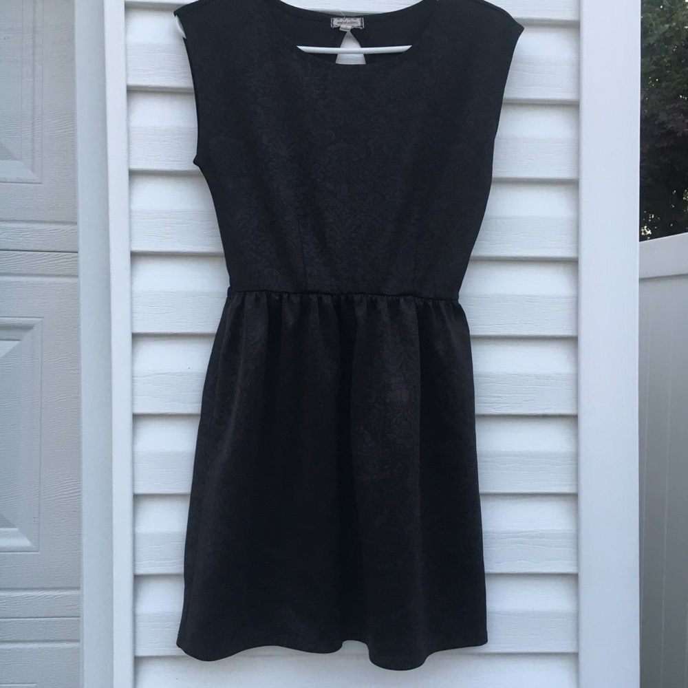 Black above knee length dress w/ cutout back