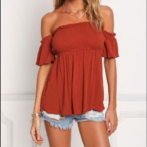Rust smocked off shoulder crepe blouse