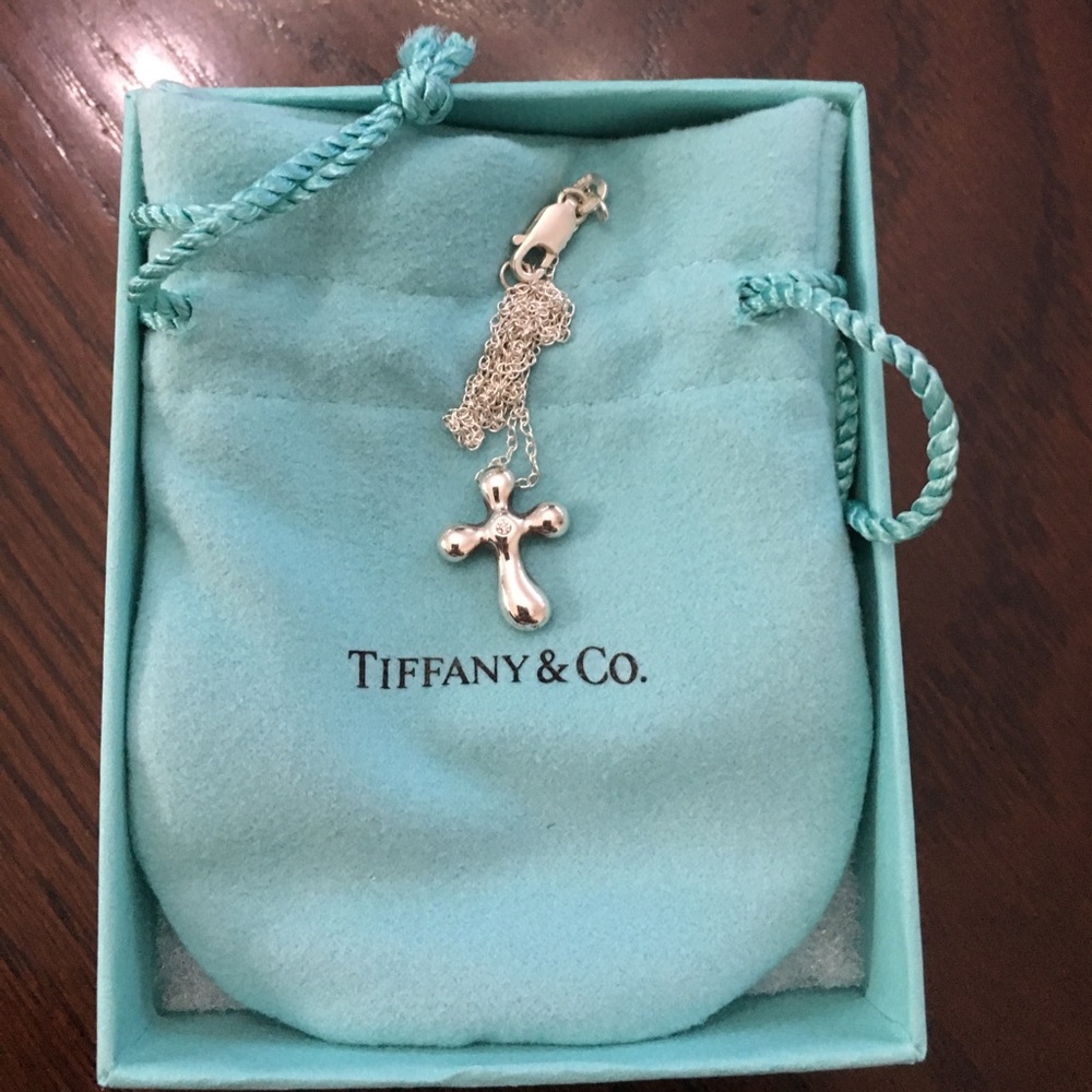 Tiffany- Elsa Peretti diamond cross pendant.