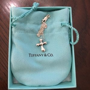 Tiffany- Elsa Peretti diamond cross pendant.