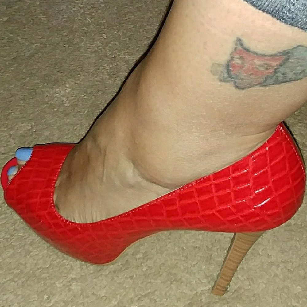 Red open toe crock patent leather heels.