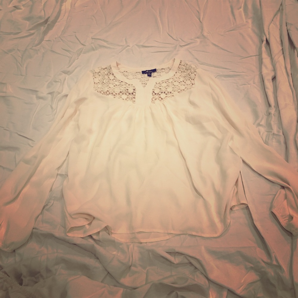 Monteau tan blouse with a floral cut out on top