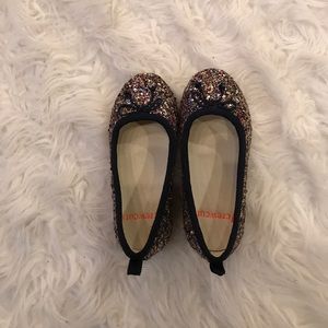 Girls sparkly flats.