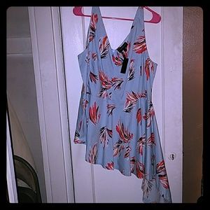 Sleeveless asymmetrical peplum top