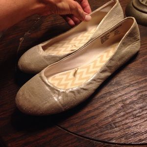 A pair of beautiful gold slippers