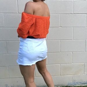 orange off the shoulders top.