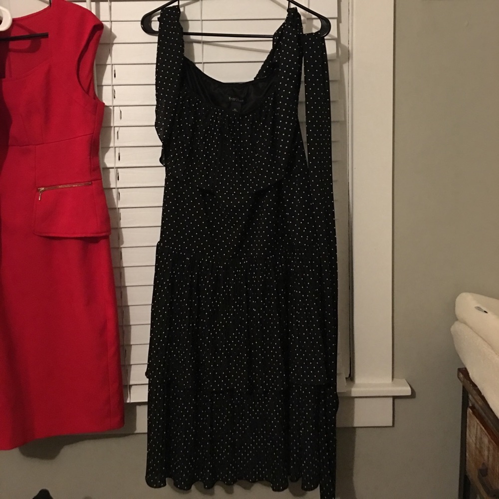 Black and white ruffled polka dot dress.