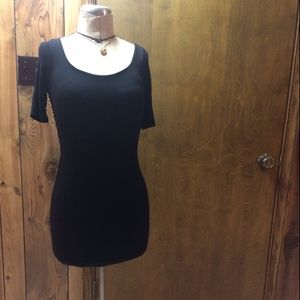 Black knit dress featuring open back with twist