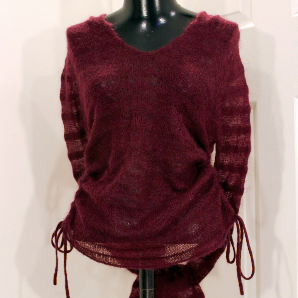 Long sleeve top with hood.