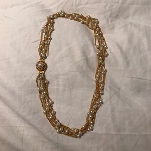 Gold and white pearl necklace. Gold and white pearl necklace.